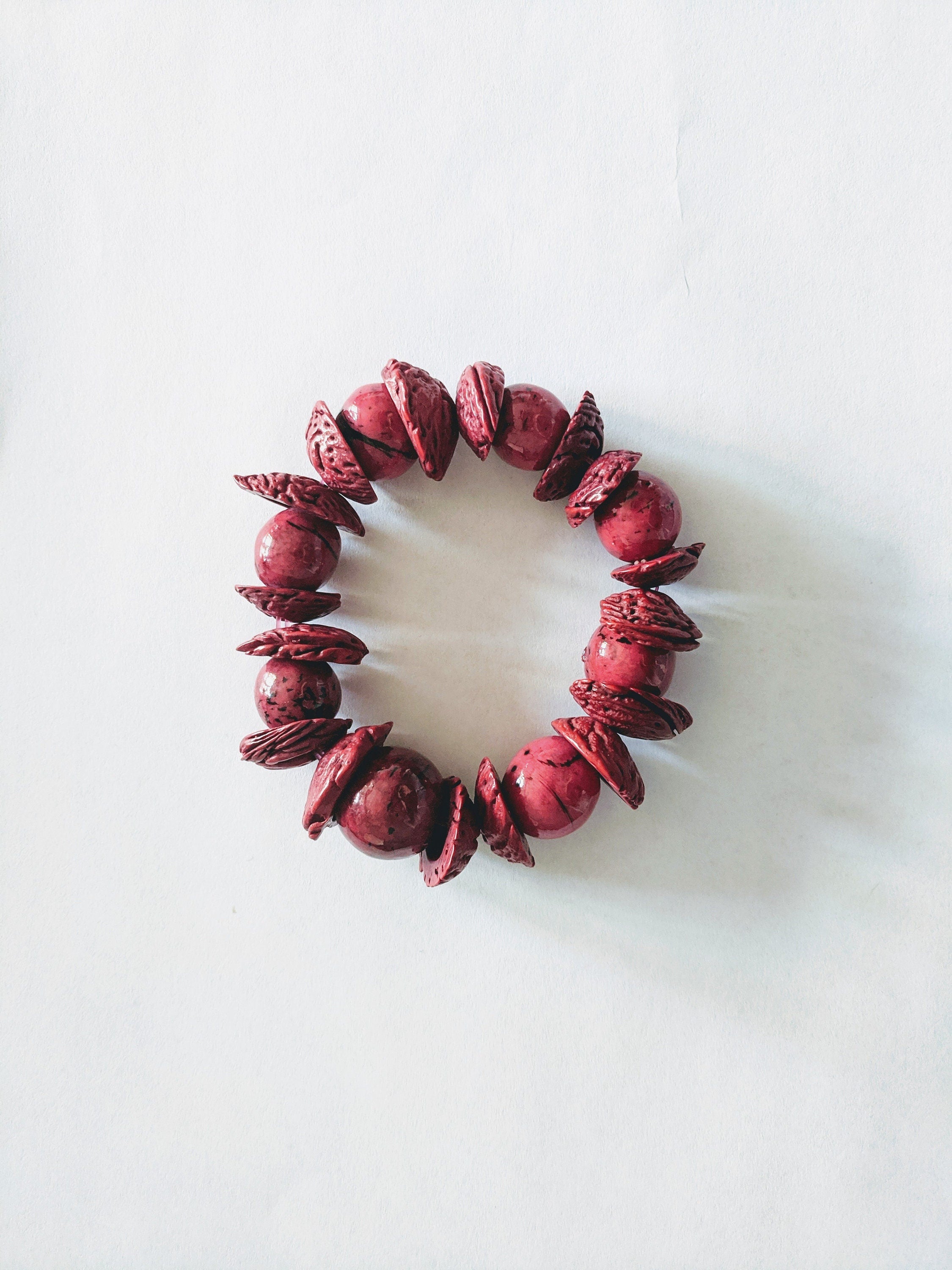 Boho big bracelet handmade using acai beads and peach seeds.