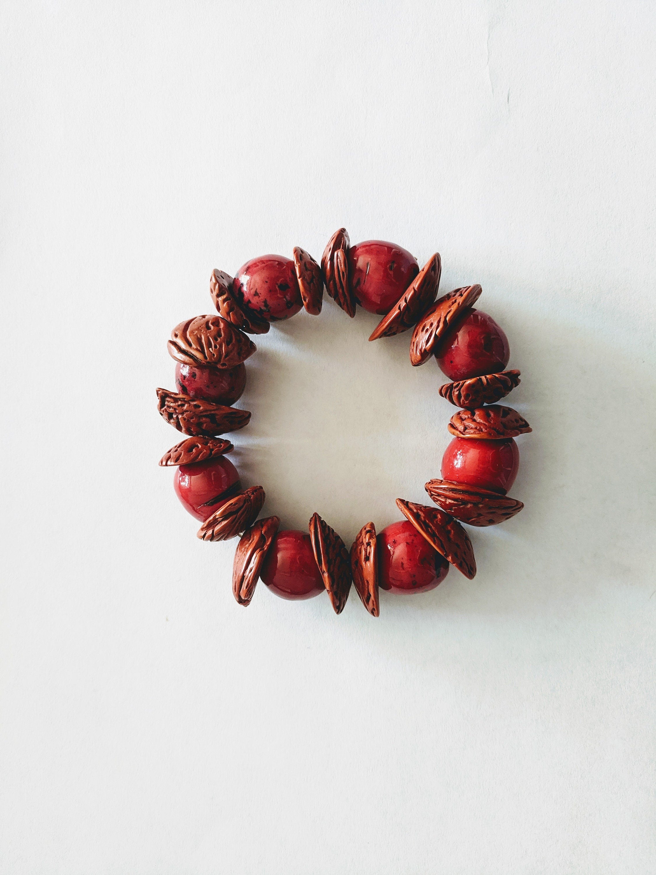 Boho big bracelet handmade using acai beads and peach seeds.