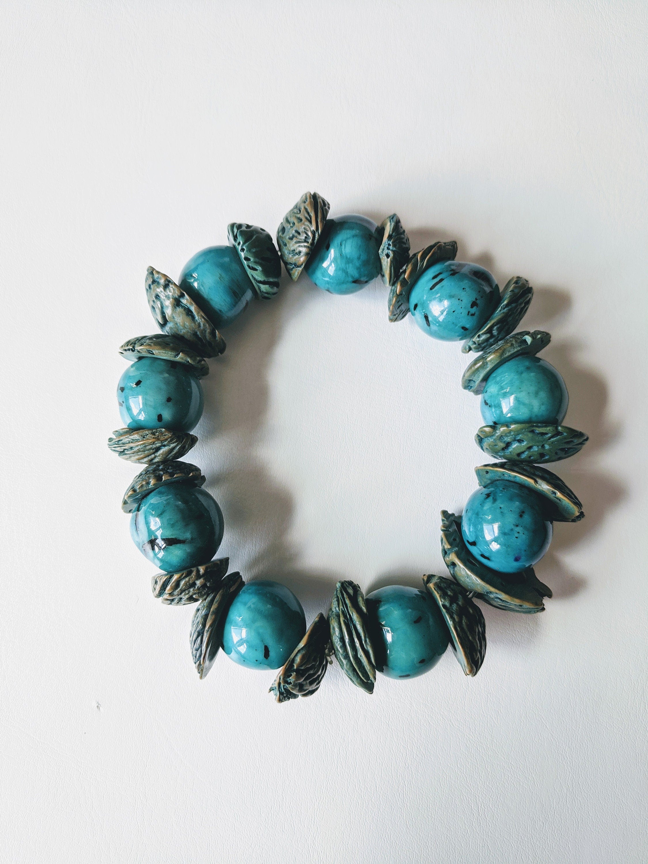 Boho big bracelet handmade using acai beads and peach seeds.