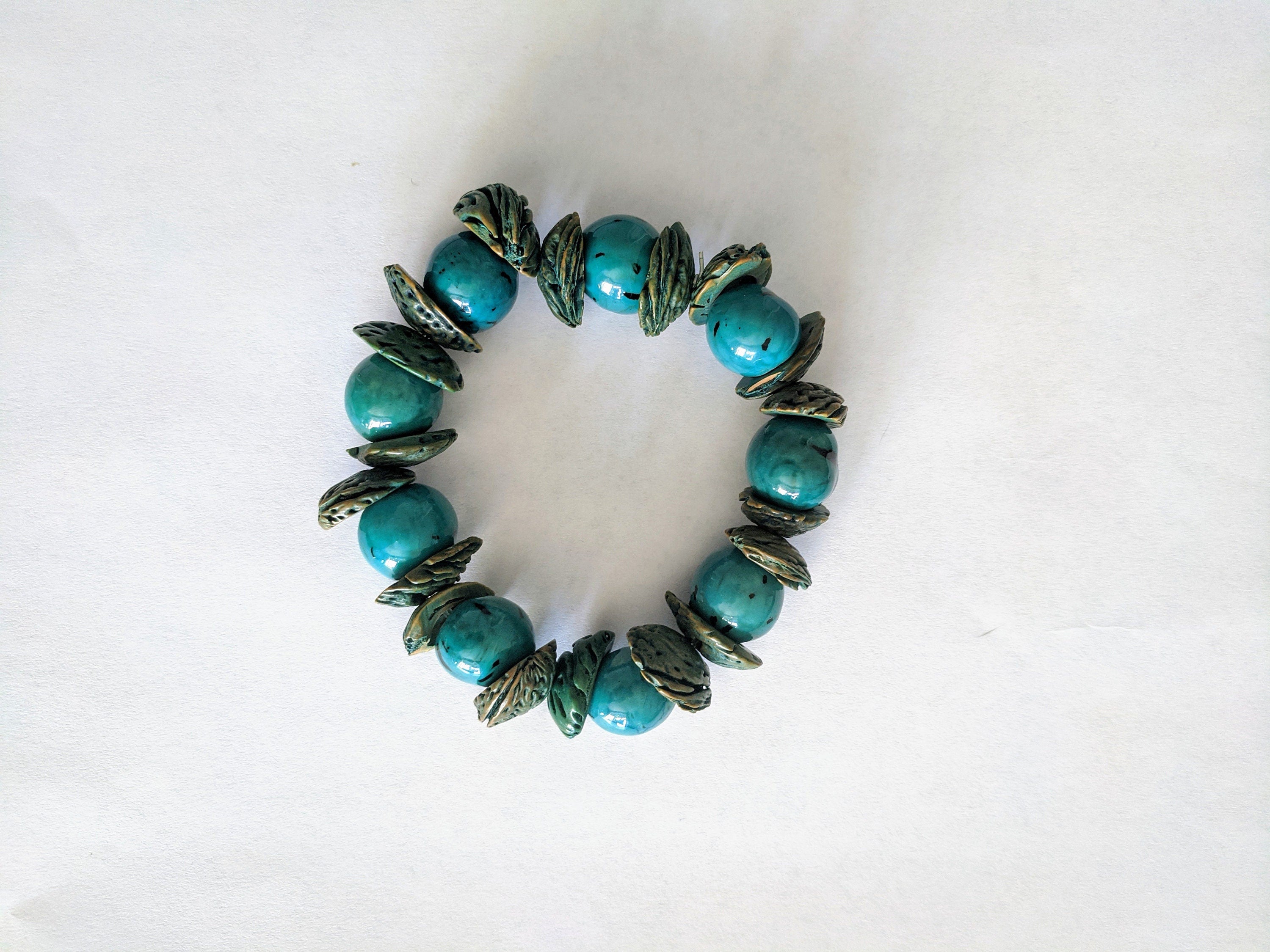 Boho big bracelet handmade using acai beads and peach seeds.