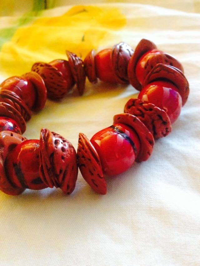 Boho big bracelet handmade using acai beads and peach seeds.