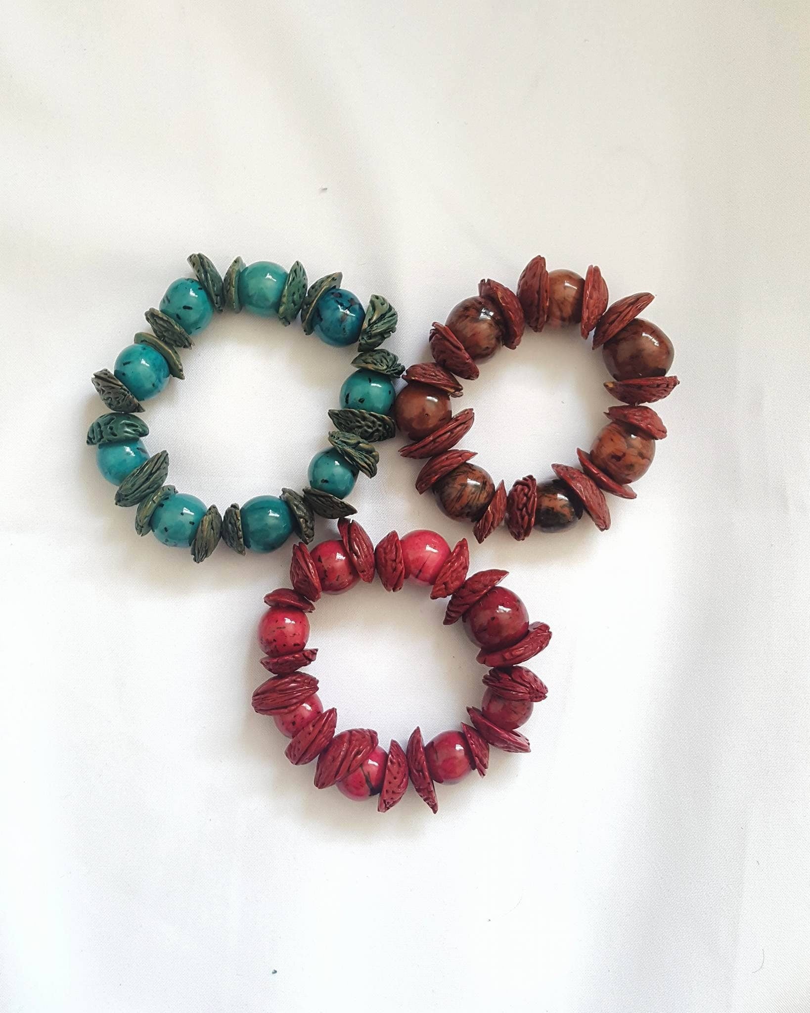 Boho big bracelet handmade using acai beads and peach seeds.