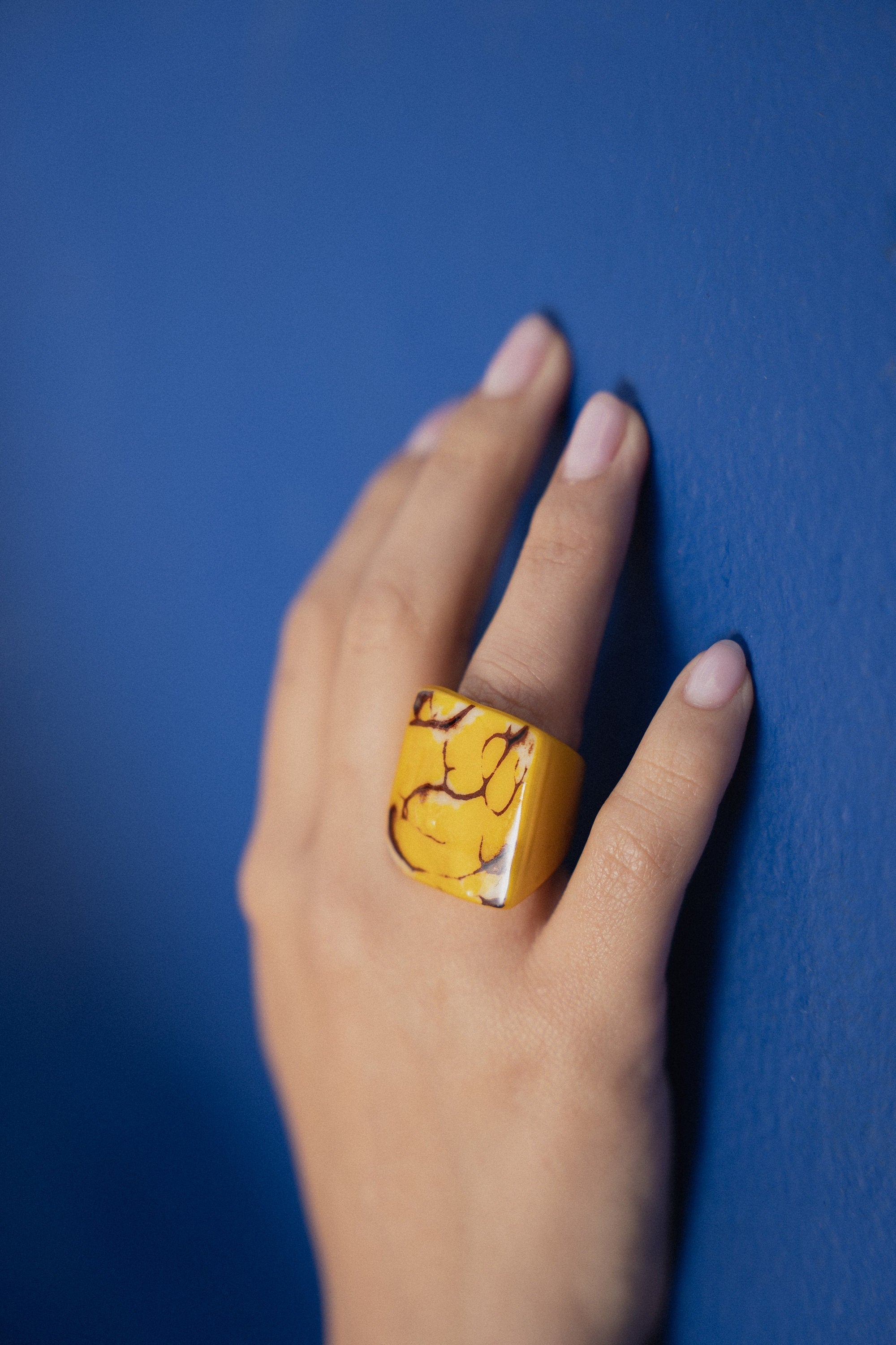 Yellow cocktail ring.