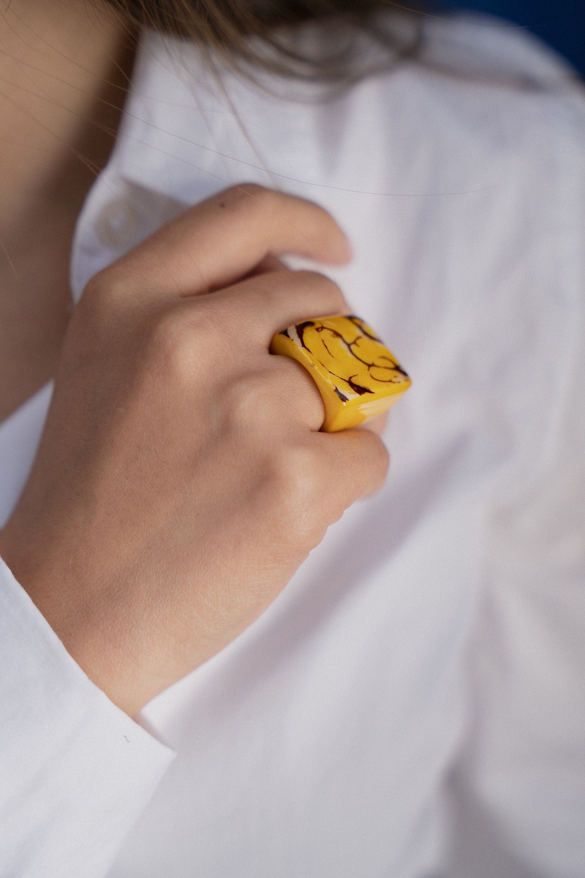 Yellow cocktail ring.