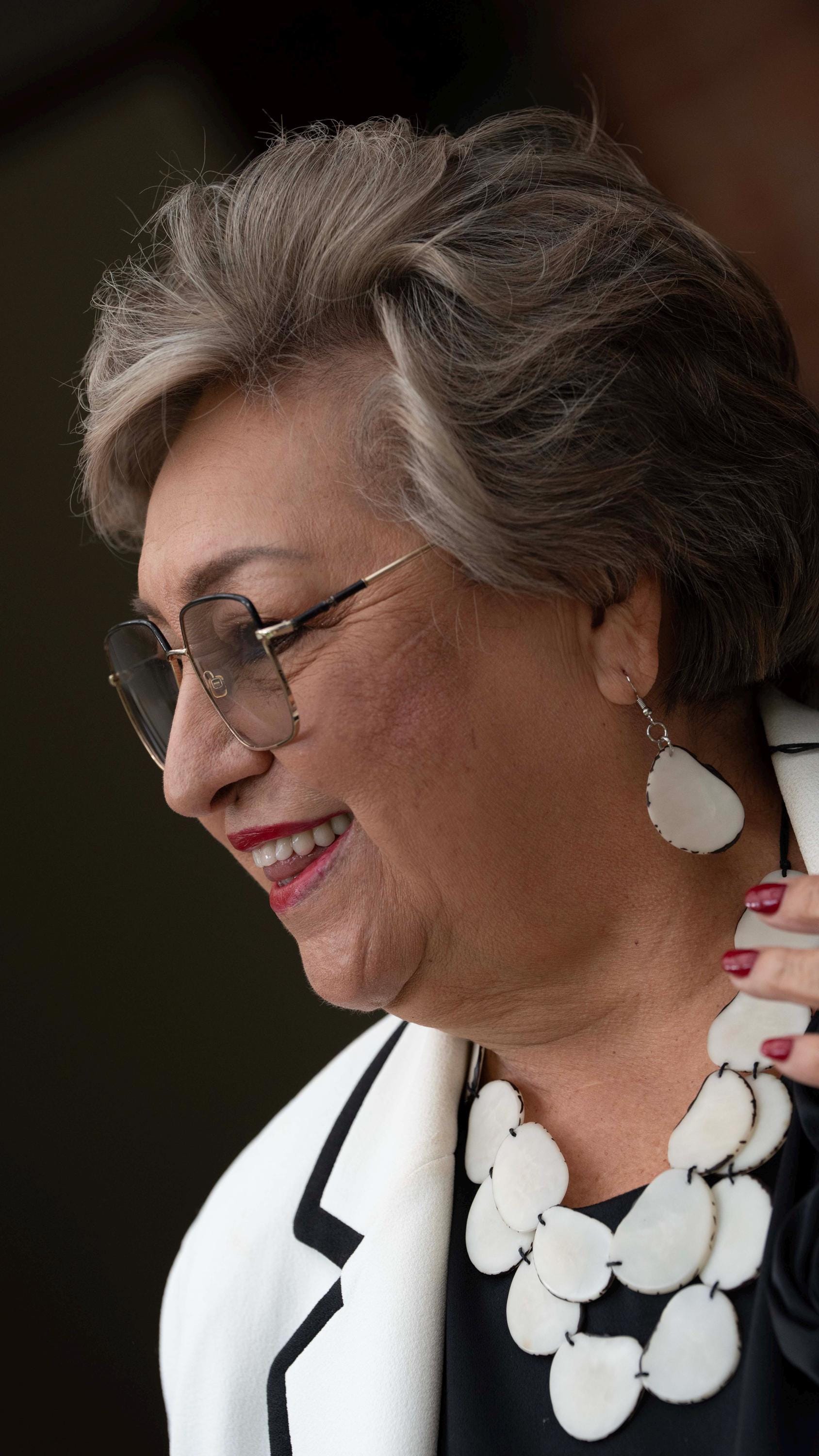 White oval earrings.